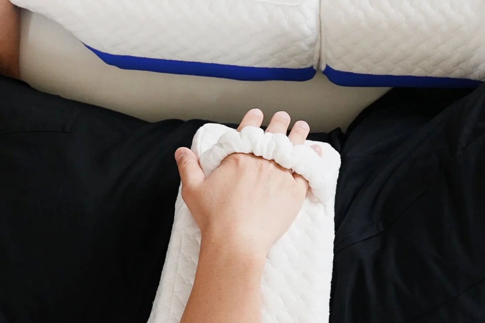 Forearm resting across the arm cradle