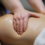 Close-up of man enjoying in relaxing back massage . Man relaxing on massage table receiving massage.