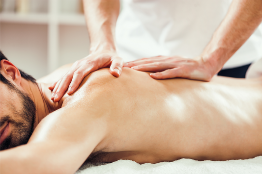Young man is enjoying massage on spa treatment.