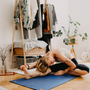 woman streching, doing yoga in yoga mat