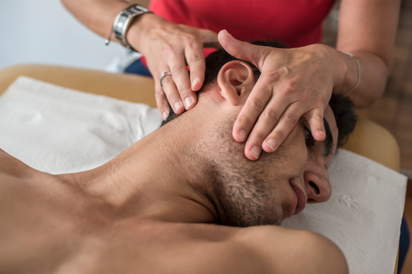 PT doctor checking cervical on men