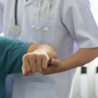 Concept of physical therapy and rehabilitation. A man with shoulder pain goes to the doctor, The doctor diagnoses the patient's arm pain and shoulder pain.
