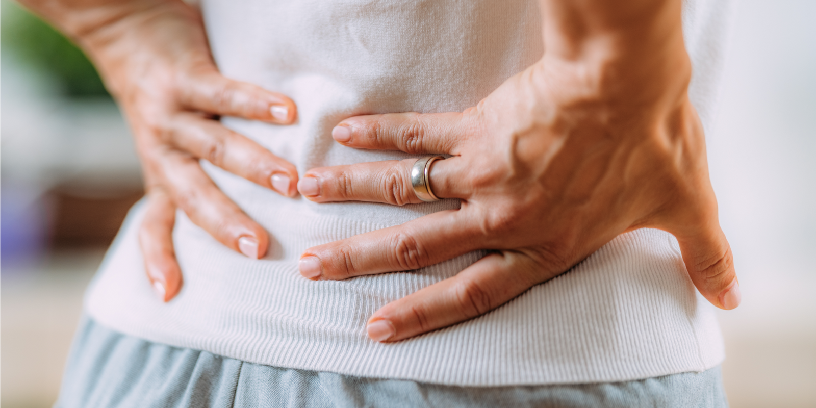 Sciatica or sciatic nerve inflammation, lower back pain. Woman with sciatic nerve pain in her lower back.