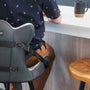 man sitting with lumbar support, sitting on a chair using lumbar support 