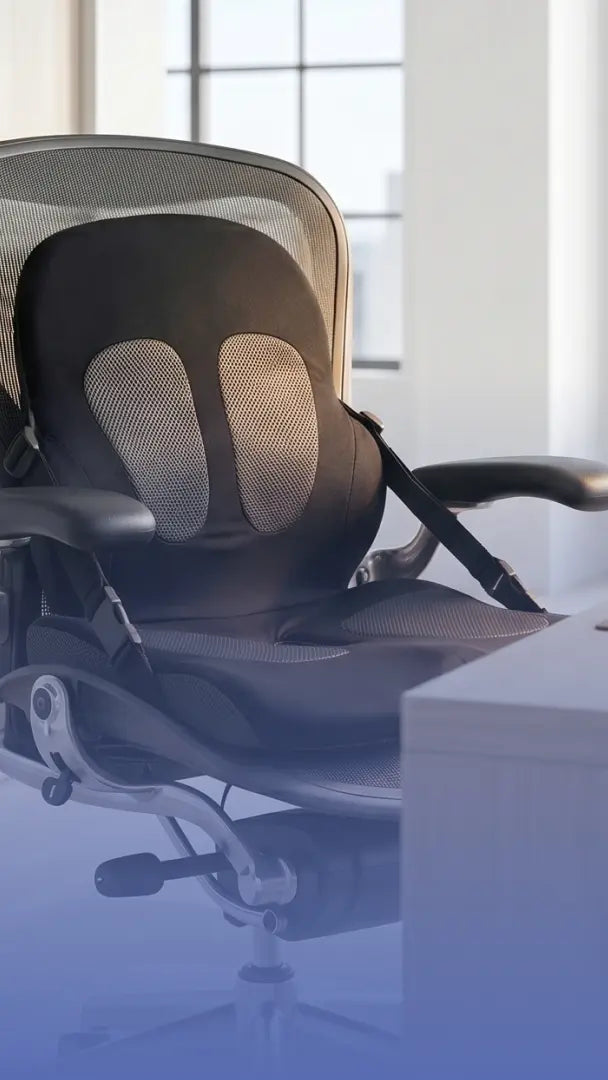 Ergonomic office chair in a bright room with a computer desk.
