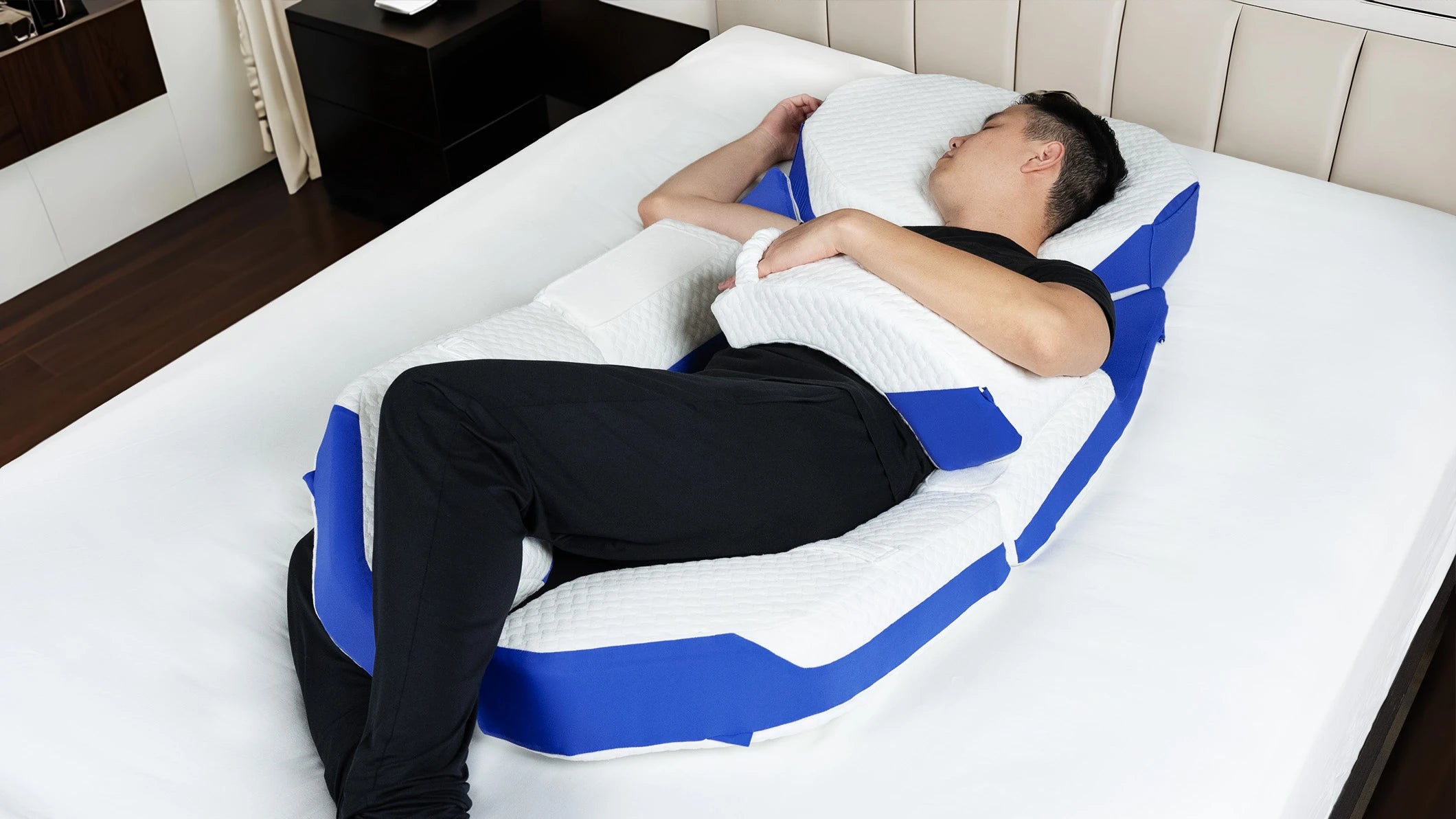 Modular Pillow holding a supported side-sleeping tilt