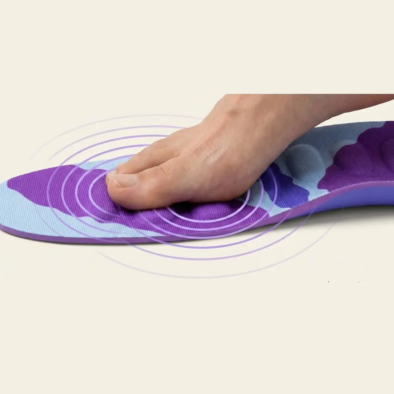 A bare foot resting on a RegenRx insole, with the raised Activation Zones under the arch and forefoot